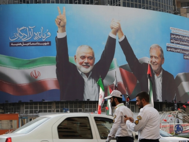 banner of iranian president masoud pezeshkian s photo taken with hamas political bureau head ismail haniyeh at the inauguration ceremony hung at veliasr street on tehran iran on august 05 2024 photo anadolu agency